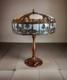 Antique Bent Slag Glass 25 Lamp With Filigree Scenic Overlay On Brass Base