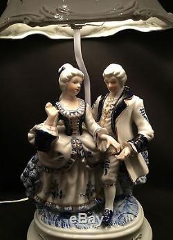 Pair of vintage baroque style porcelain figurine lamps with porcelain shades